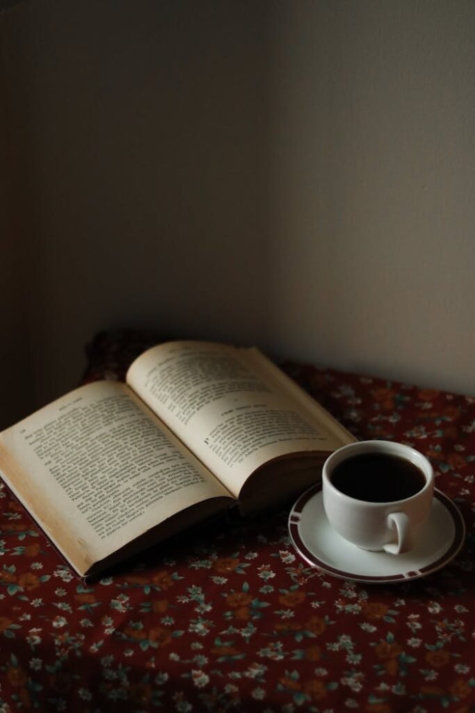 Opened Book and Coffee Cup